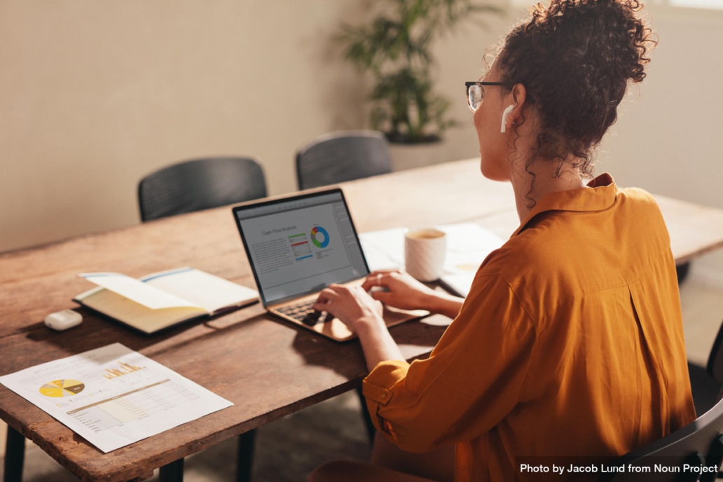 Business woman working on laptop preparing financial report